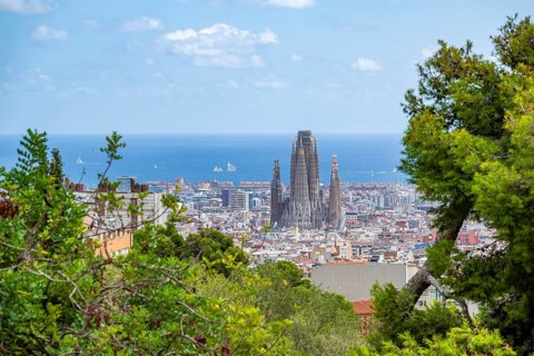 View from the Parc Güell towards the city with Sagrada Familia and Torre Agbar, Mediterranean Sea