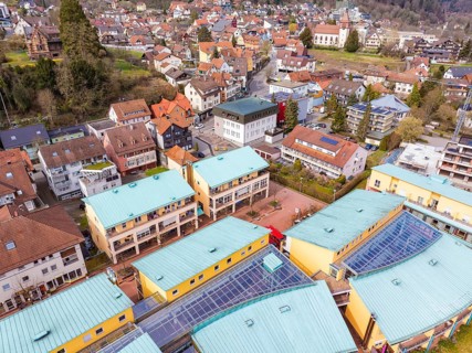 Overview of a residential area with colourful roofs and hills in a small town, Bad Liebenzell,