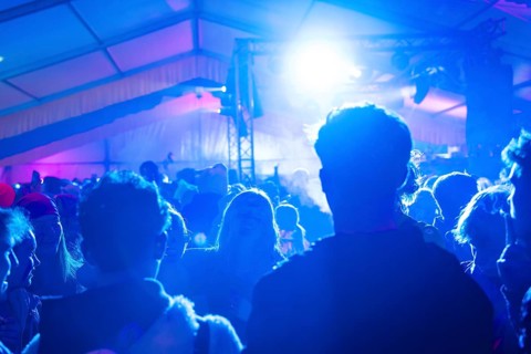 Party in full swing with blue lights and dancing people, carnival, Schlagerkuchen Donzdorf,