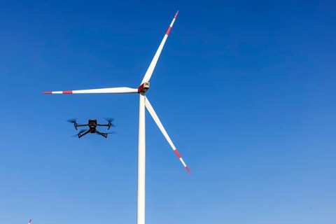 A Mavic 3 Pro drone flies for a wind turbine in a wind farm. Dornstadt, Baden-Württemberg, Germany