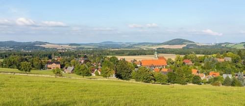 View of the village from the Sängerhöhe with church, school and half-timbered houses, in the