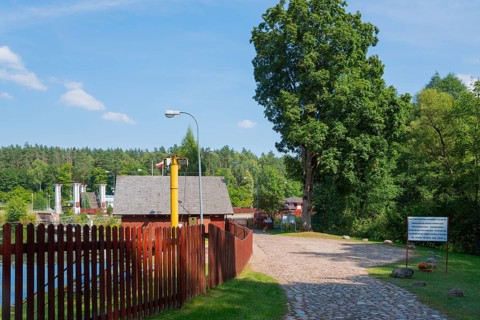 Paved path with trees and view of the lock, sunny summer day, Sluza Kurzyniec, Sluza, lock, border