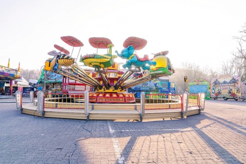 Children's carousel with colourful figures and a cheerful atmosphere at a fair, Fasnet, Weil der