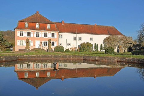 Historic noble house of the Roman Museum with Roman equestrian statues and reflection in the water,