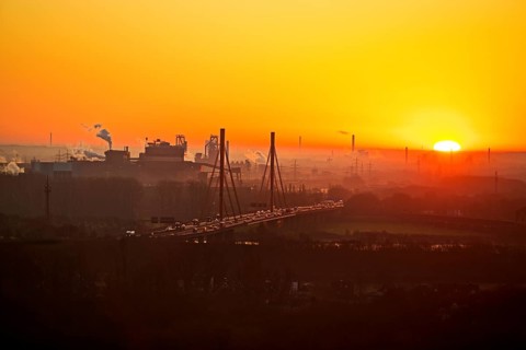 Atmospheric view of the ThyssenKrupp plant with the A 42 motorway at sunrise, Duisburg, North