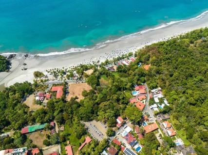 Aerial view, coast and town, Corrohoe Bay and Playa Espadilla, Manuel Antonio National Park,