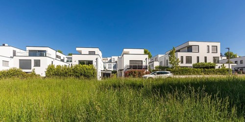 Modern detached houses with heat pumps in new development area, energy-saving house, efficiency