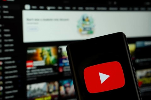 Dhaka, Bangladesh- 10 July 2025: Youtube logo is displayed on a smartphone screen, with the website