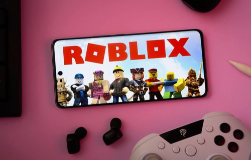 Dhaka, Bangladesh- 26 July 2025: A close-up of a gamepad with the Roblox seen on smartphone