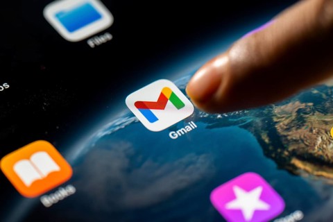In this photo Illustration a person taps Gmail App icon on a tablet device on 24 May 2025 in New