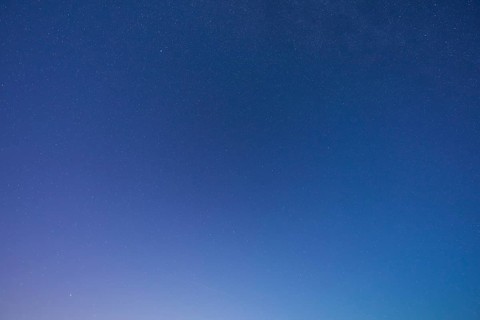 A clear starry sky with soft blue tones at dusk creates a peaceful atmosphere, Spessart, Bavaria