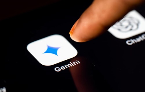 In this photo Illustration a person taps Gemini App icon on a tablet device on 24 May 2025 in New