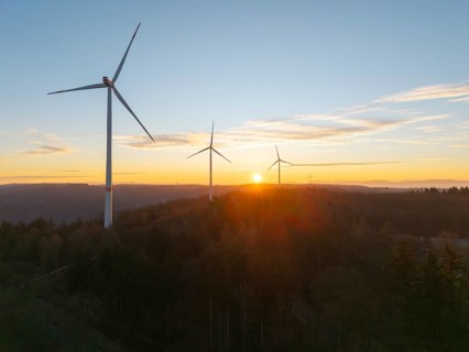 Tranquil landscape with wind turbines at sunrise over wooded area, wind farm, Rems Valley,