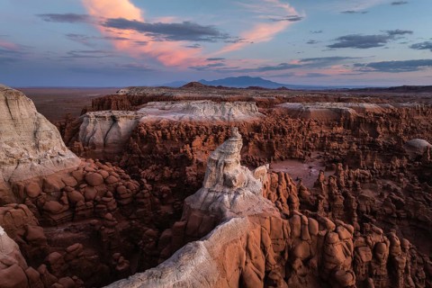 Stunning aerial photograph capturing Goblin Valley State Park, Utah, at sunset with its unique rock