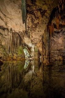 Huge stalactites and underground lake, stalactite cave Grotta di Nettuno, Neptune Grotto, Capo