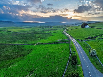 Forest in Teesdale over River Tees from a drone, North Pennines AONB, County Durham, England,