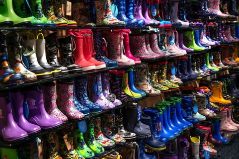 Colourful rubber boots in a shoe store, Bavaria, Germany