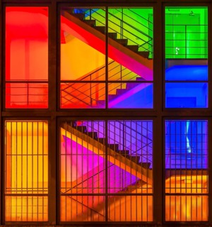 View through the windows of a brightly lit staircase. Frankfurter Mainova AG building, city center,