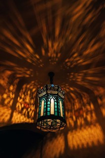 From below colorful lamp with glowing lights in dark room