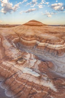 Stunning aerial shot capturing the intricate layers and rolling hills of bentonite clay in Utah's