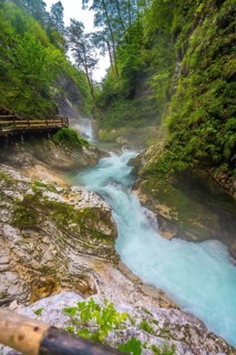 Breathtaking view of the turquoise radovna river carving its way through the stunning vintgar