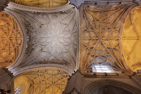 Elaborately decorated Gothic ceiling of a cathedral, Seville, Andalusia, Spain