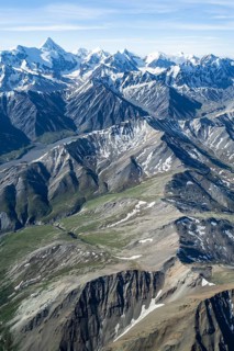 Snow and ice, epic mountains with glaciers, aerial view, Alaska Range, Denali National Park,