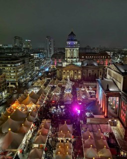 View from above of lively Christmas market atmosphere at night on the Gendarmenmarkt, Berlin