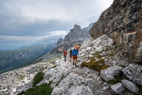 Three mountaineers on a hiking trail, rocky mountain landscape, Via Ferrata SOSAT via ferrata,