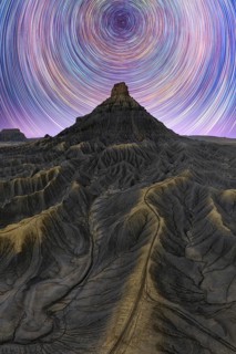 Stunning night view of the Milky way over Utah sandstone desert, showcasing star trails in a clear