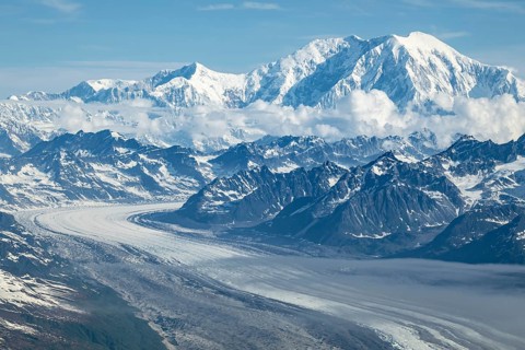 Clouds over high mountains, Mt Foraker with Kahlitna Glacier, aerial view, Alaska Range, Denali