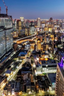 Osaka city from above with the skyline skyscrapers at night in Osaka, Japan