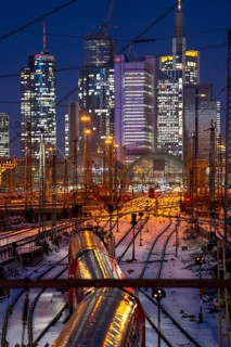 Railway tracks in front of the main railway station in Frankfurt am Main, skyline of skyscrapers in