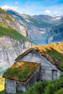 Blomberg Gård, historic mountain farm on steep mountainside, Geirangerfjord, near Geiranger, Møre
