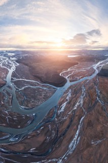 Breathtaking aerial view of meandering rivers in Iceland's Highlands, capturing the dramatic
