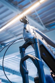 Top view of a bicycle fork and frame with light in a modern workshop environment, Waldbike