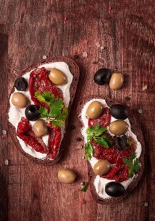 Breakfast, sandwiches, with cream cheese, olives, top view