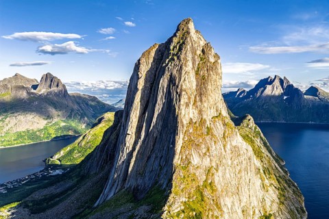 Aerial view of Mt. Segla, in the back Mt. Breidtinden, Senja Island, Norway
