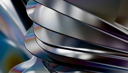 This image features smooth, flowing metallic curves with reflective surfaces in a 3D render,