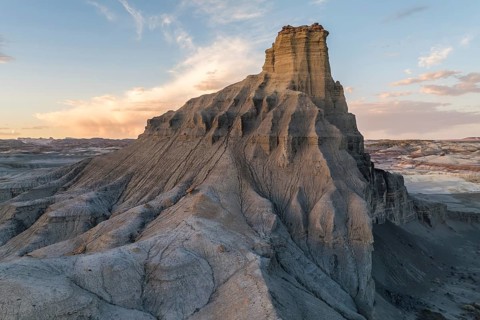 A breathtaking landscape of towering rock formations captured at sunset, showcasing the serene