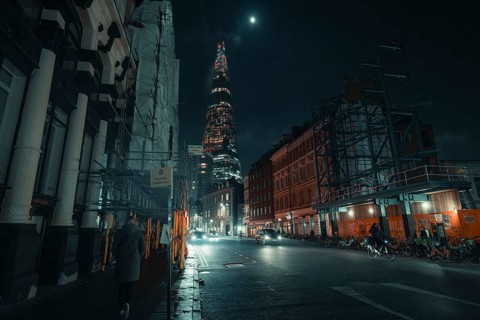 Street scene at night with illuminated buildings and a tranquil atmosphere, New Year's Eve London,