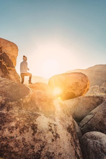 Woman hiking at sunrise in Joshua Tree National Park