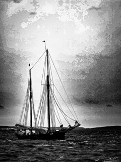 A sailing ship in black and white on the sea with dramatic sky, Baltic Sea, Germany