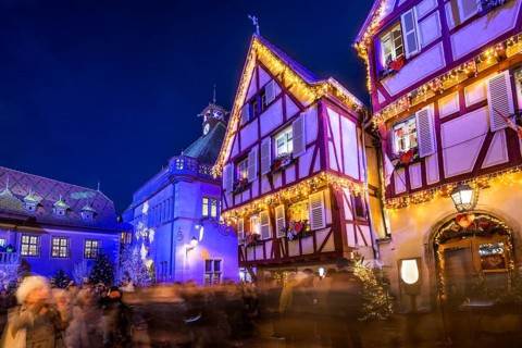 Colourfully illuminated and Christmassy decorated half-timbered houses, old town, blue hour,