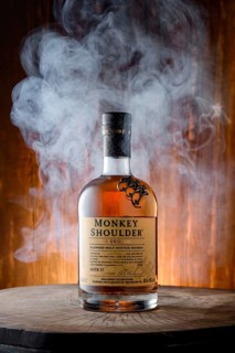 April 8, 2022, Minsk, Belarus, bottle of Monkey Shoulder blended malt scotch whisky surrounded with