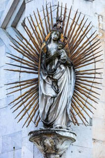 Mary with the Infant Jesus on the façade of the church of San Michele in Foro, historic city