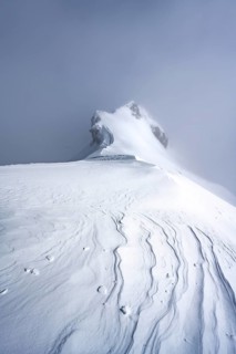 Drifting snow, mountain ridge, snow-covered mountain landscape, ascent to the Wildhorn, cloudy