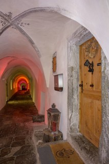 Colourfully illuminated cloister in the Carthusian monastery of Allerengelberg, Schnalstal Valley,