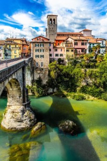 Ponte del Diavolo from the 15th century leads over the Natisone river into the historic centre,