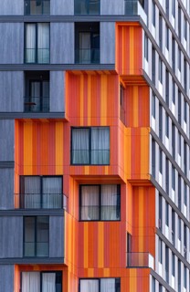 Detail of modern architecture blending glass, concrete, and metal in a suburb high-rise building,